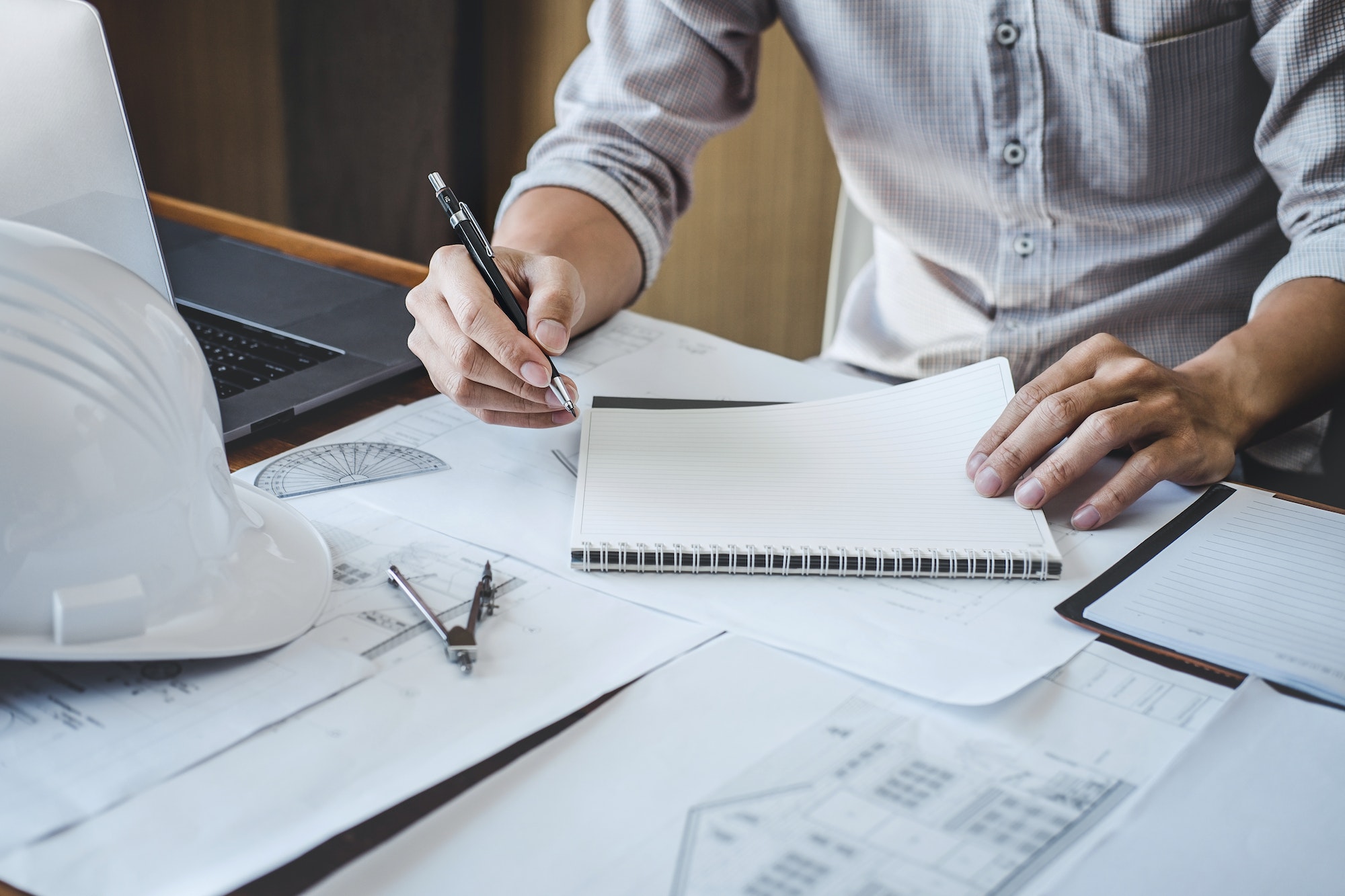 Construction and structure concept of engineer or architect working on blueprint